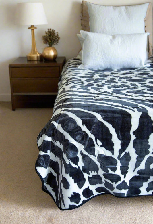Paris Faux Mink Blanket Queen Size styled on a bed for a cozy look, cheetah print blanket. faux mink blanket