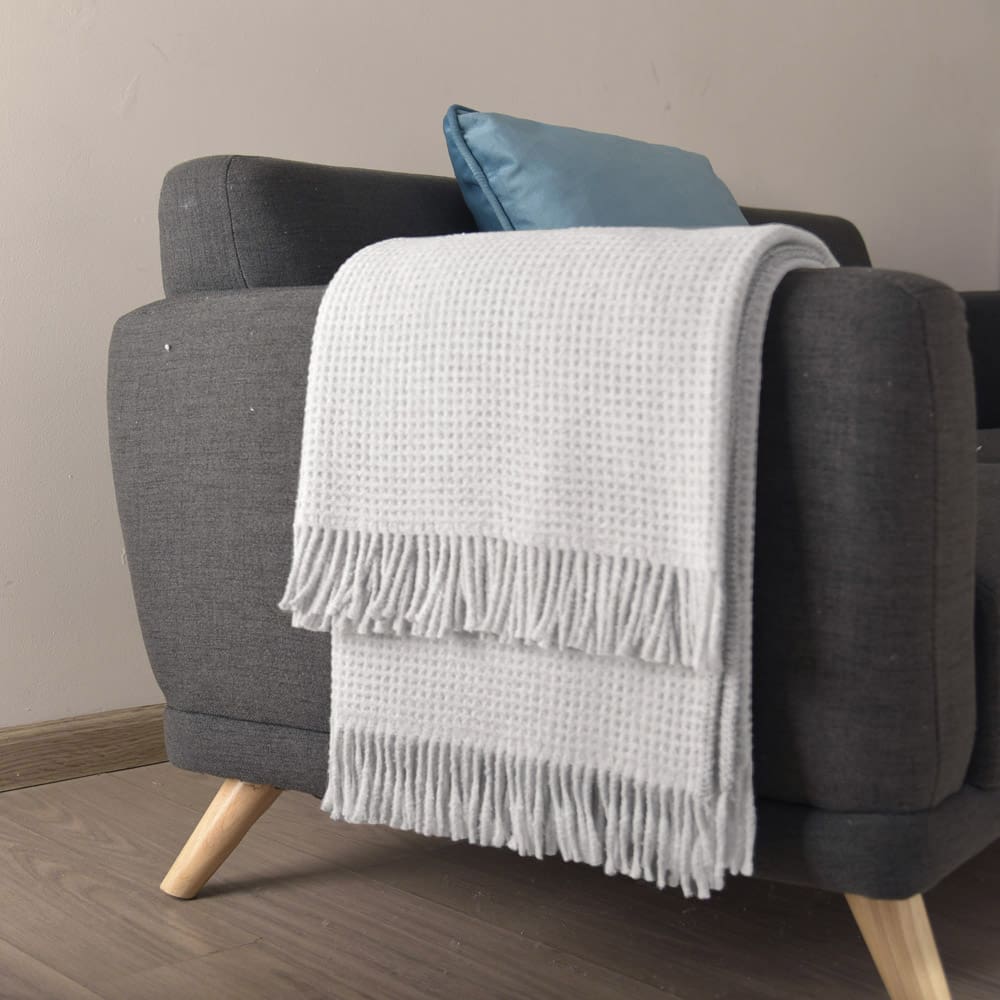 Colorful Scotch Throw Blanket draped elegantly on a couch