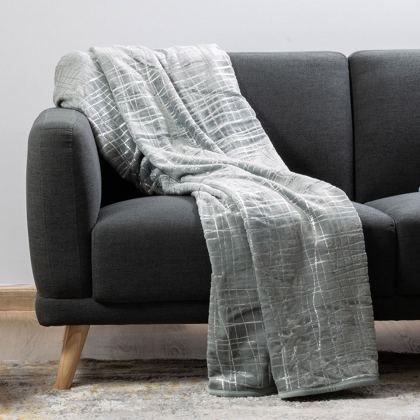 Gift-ready plush luxury blanket in silver wrapping or packaging