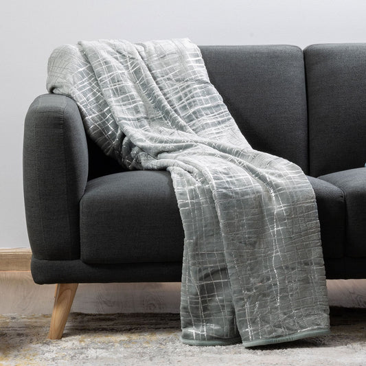 Gift-ready plush luxury blanket in silver wrapping or packaging