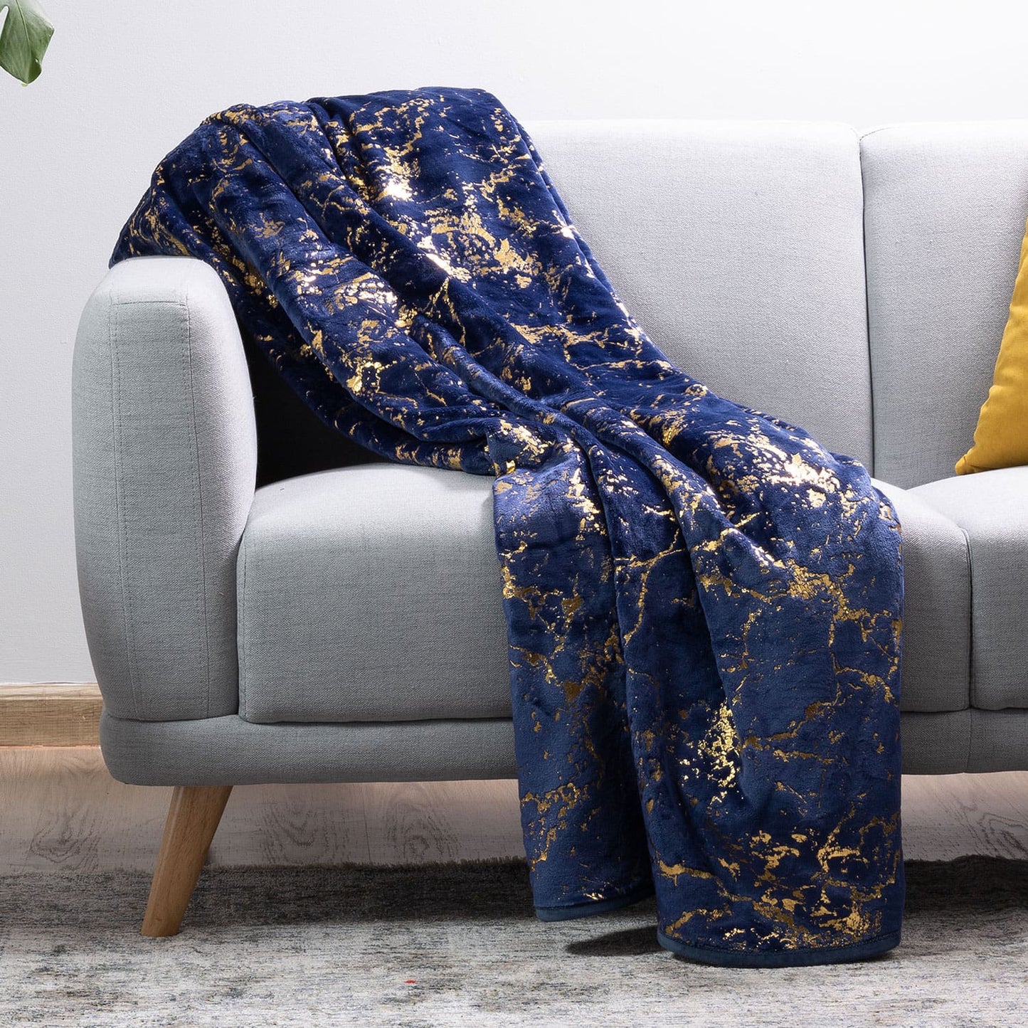 Gold plush luxury blanket neatly folded for display