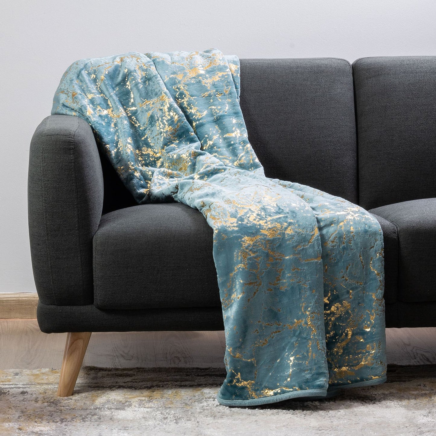 Plush Luxury Throw Blanket placed on bed, offering comfort and warmth