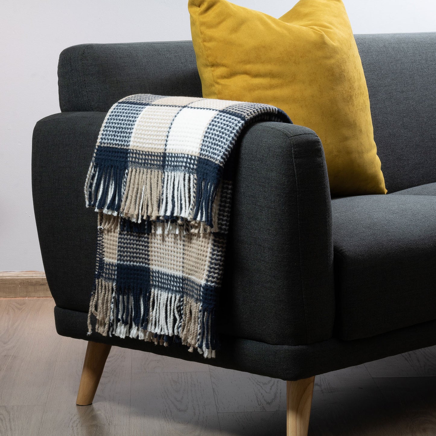 Colorful Scotch Throw Blanket on a couch for cozy comfort
