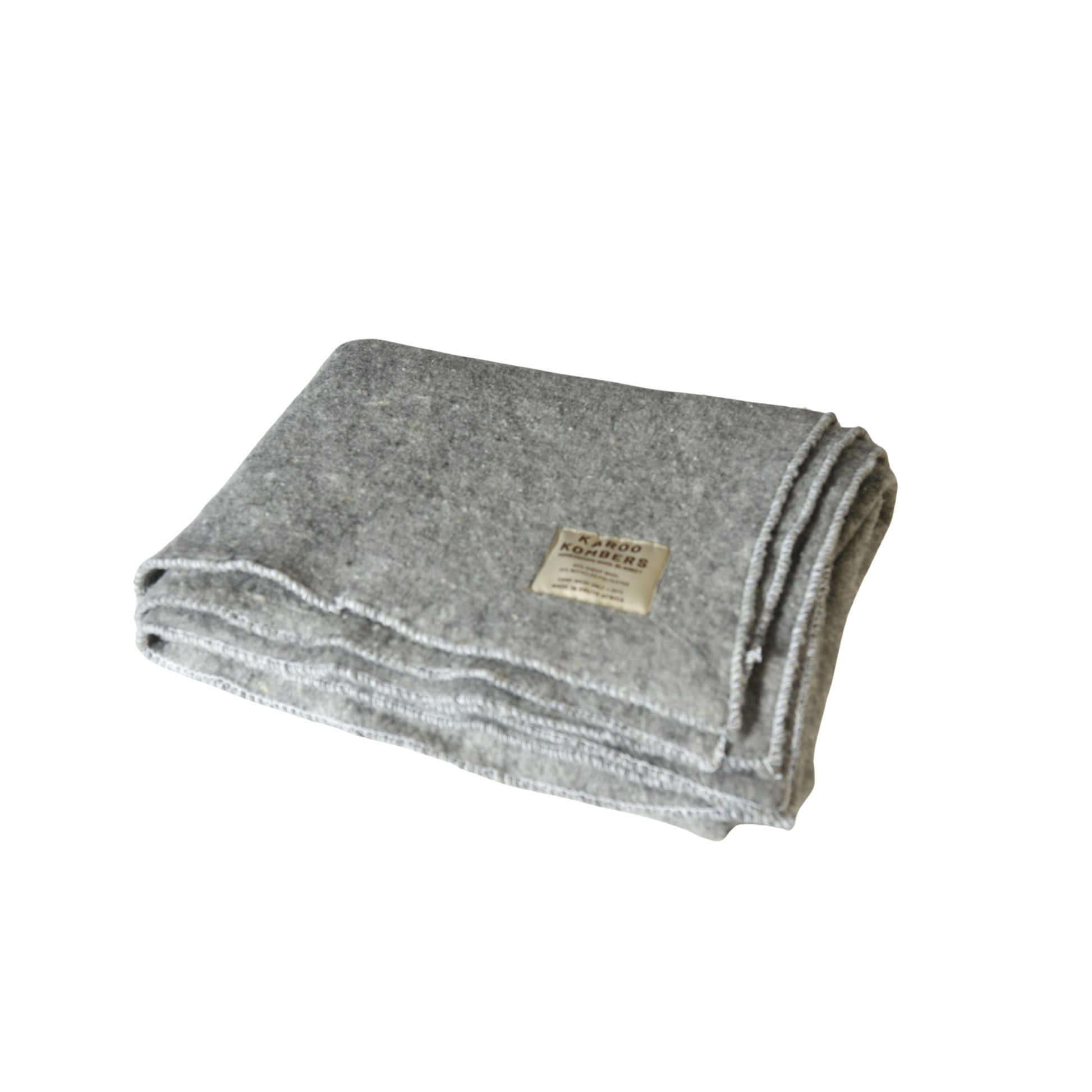 A folded gray wool blanket with a small beige label, shown on a plain white background.