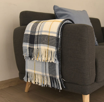 Stylish Colorful Scotch Throw Blanket folded on a chair