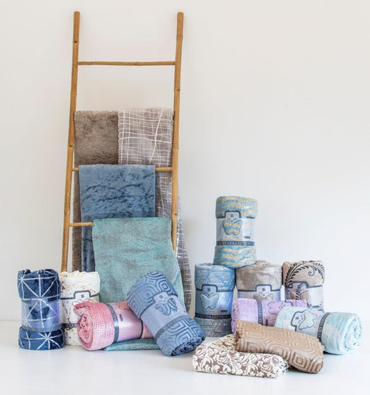 Plush Luxury Throw Blanket draped over couch, adding warmth and style