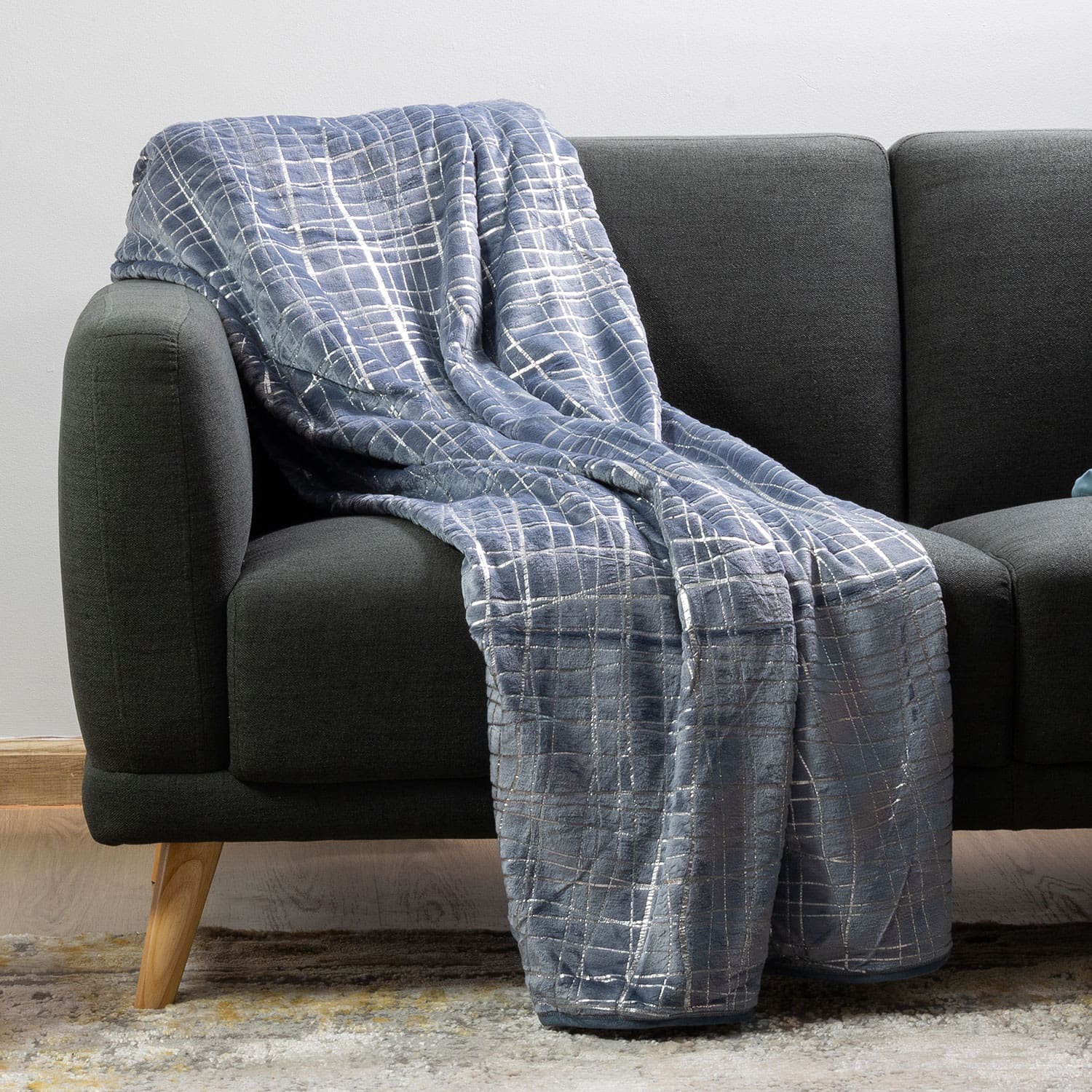 Warm plush luxury blanket used as a stylish home accessory
white marble blanket, black marble blanket, marble blanket, white marble plush, grey marble throw, grey and silver throw,  white and silver  plush, white and silver plush, denim blue and silver throw, denim blue and silver plush 